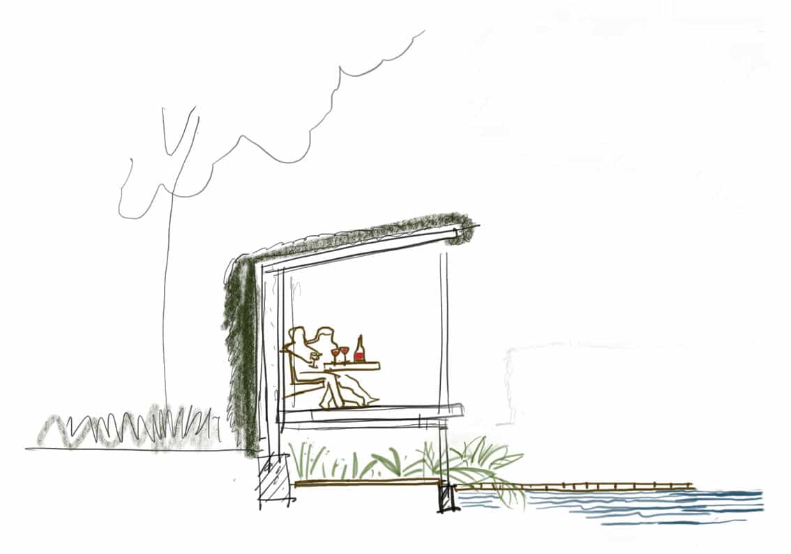 Het tuinhuis volledig begroeid en biedt een geborgen plek aan het water.